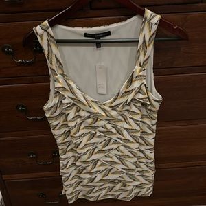 NWT - White House Black market blouse with stacked material . Unique print.